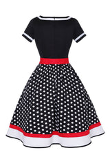 Schwarzes Polka Dots Rockabilly Kleid mit V-Ausschnitt aus den 1950er Jahren