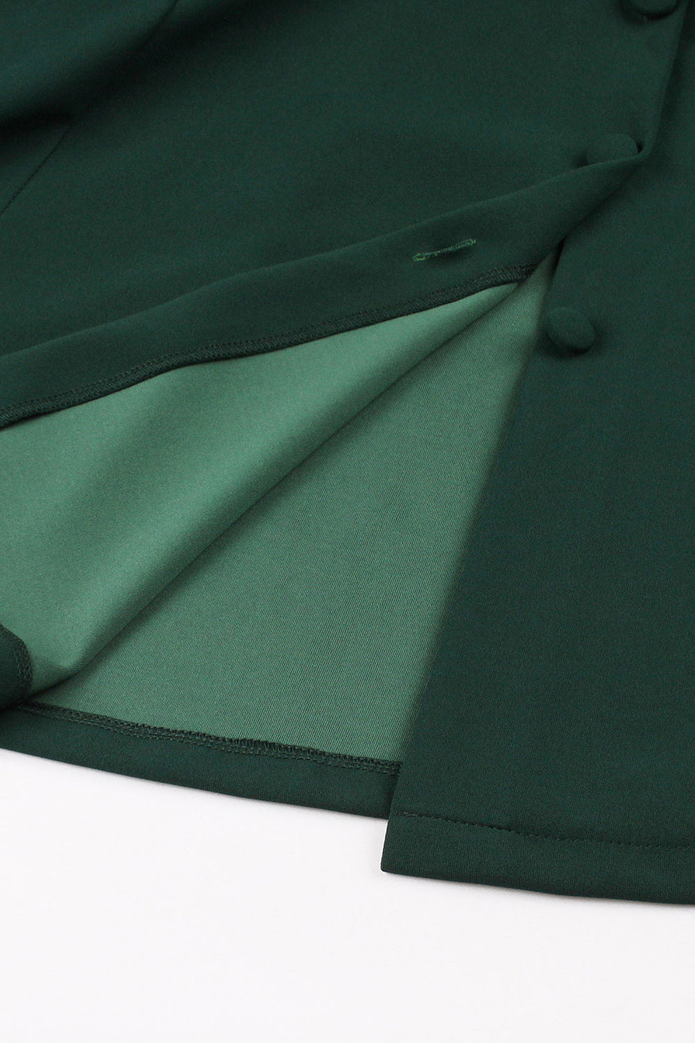 Grünes Kleid mit tiefem V-Ausschnitt aus den 1950er Jahren und kurzen Ärmeln